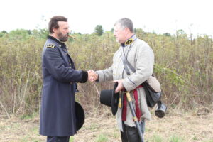 C'Ville 2013 Grant and Chalmers (Larry McCluney Jr.) shake hands Photo by Joe Krisle